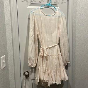 Brand: Flawless. Oatmeal color. Long sleeves.